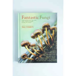 The book Fantastic Fungi by Louie Schwartzberg is shown, featuring a cover with brown mushrooms on a log and the subtitle: How mushrooms can heal, shift consciousness & save the planet.