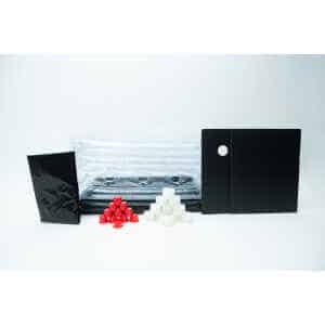 The Boomer Shroomer V 2.0 Inflatable Monotub Kit for Growing Mushrooms includes black and clear plastic sheets, a black rectangular bag, two ventilated panels, and pyramid-shaped red and white filter plugs—perfect for mushroom cultivation.