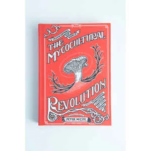 The Mycocultural Revolution: Book by Peter McCoy is shown, featuring a red cover with an illustrated mushroom and decorative white designs, highlighting fungi’s roles in philosophy, medicine, and cuisine.
