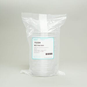 A sealed plastic pack holds a stack of clear 90mm NEST Petri dishes, 3-vent, sterile, gamma irradiated. The white and blue label displays item no. 752204 and barcode, set against a plain light background.
