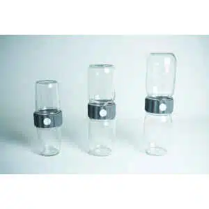 Three stacked Plant Cell Biocouplerâ„¢ Glass Set containers (473ml, 355ml, 237ml) are paired with a white circular biocoupler, perfect for plant tissue culture, and displayed side by side on a plain light background.