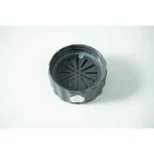 The Plant Cell Biocoupler™ collar only (regular mouth) is a black, round plastic lid with a slotted radial centre, textured edges, and a hole on one side, shown resting on a plain white surface.