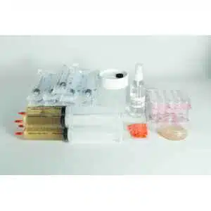 The Liquid culture to Liquid culture expansion Kit includes packaged syringes, an expansion kit for liquid cultures, a white container, spray bottle, orange needle caps, petri dish, and sealed ampoules arranged on a white surface.