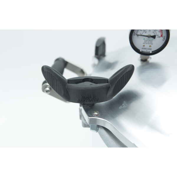 Close-up view of the black handle and pressure gauge on a stainless steel All American Steriliser, with "Made in Australia" on the handle. Shown with the Rootlab Original 3D Printed Wingnut Spanner for All American Steriliser.