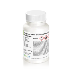 A white bottle labelled "Plant Cell Hoagland's No. 2 Basal Salt Mixture," with a white screw cap, hazard symbols, warning text, and manufacturer details; commonly used in plant cell culture.