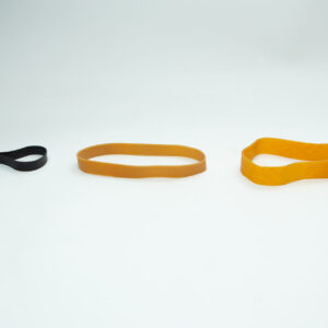 Ten reusable Fruiting Rubber Bands for mushroom growing are displayed in a row on a plain white background, featuring different sizes and colours—black, light brown, and orange.