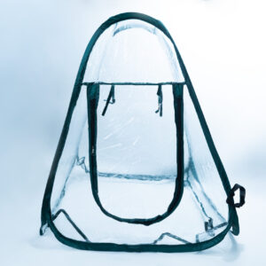 A transparent, portable pop-up tent with a zippered front entrance, dark trim, and a handle at the base, set against a plain white background.