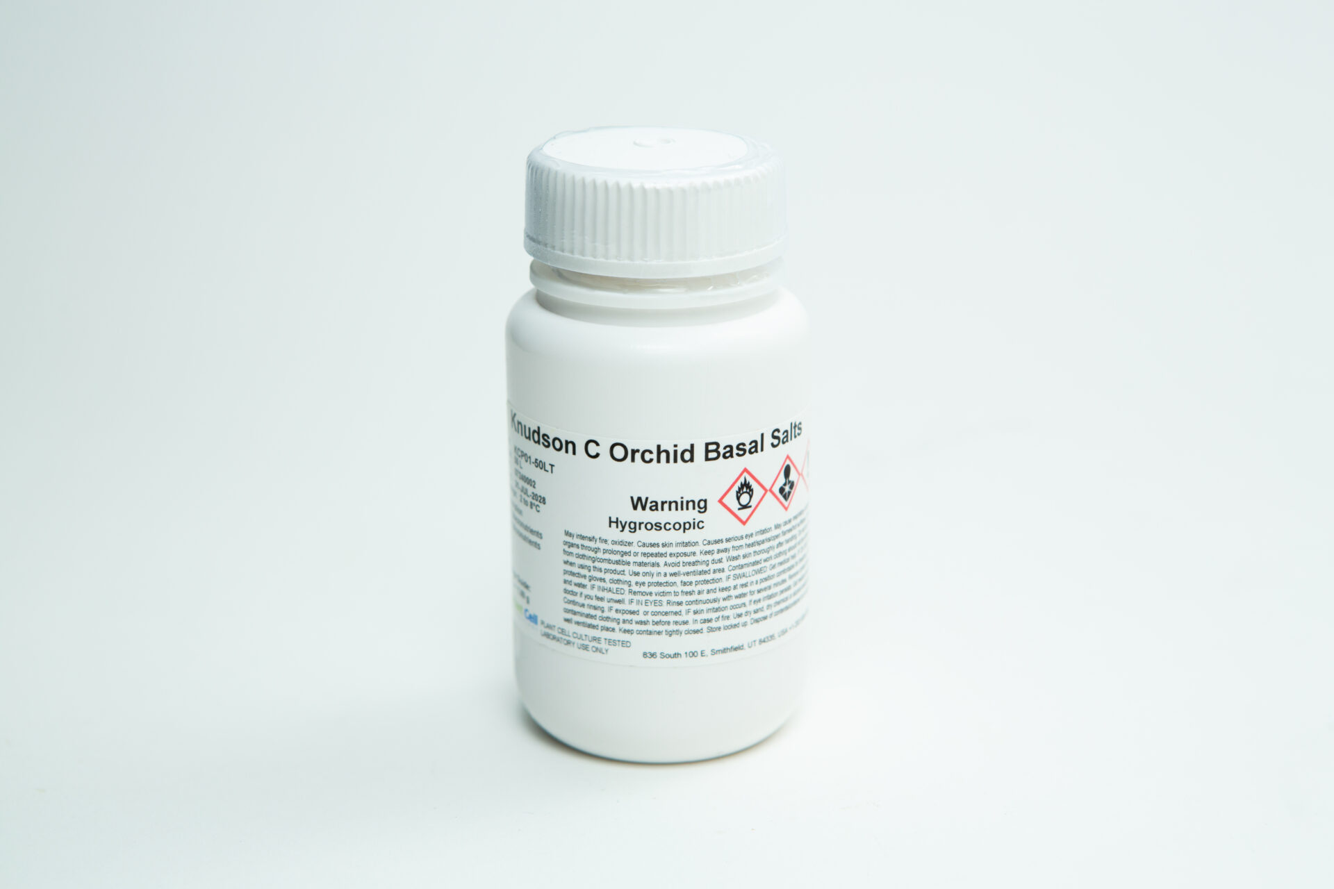 Plant Cell Knudson C Orchid Basal Salts - Orchid Germination Media | Makes 10L 2 A white plastic bottle labelled Knudson C Orchid Basal Salt, with warning symbols and safety information, is shown on a plain white background.