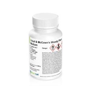 A white plastic bottle labelled Lloyd & McCowns Woody Plant Medium displays hazard symbols and extensive safety information on the front, with a white cap and a Plant Cell logo at the bottom.